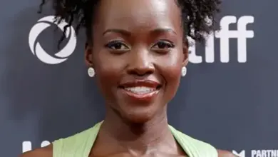 Lupita Nyong'o smiling at a film premiere